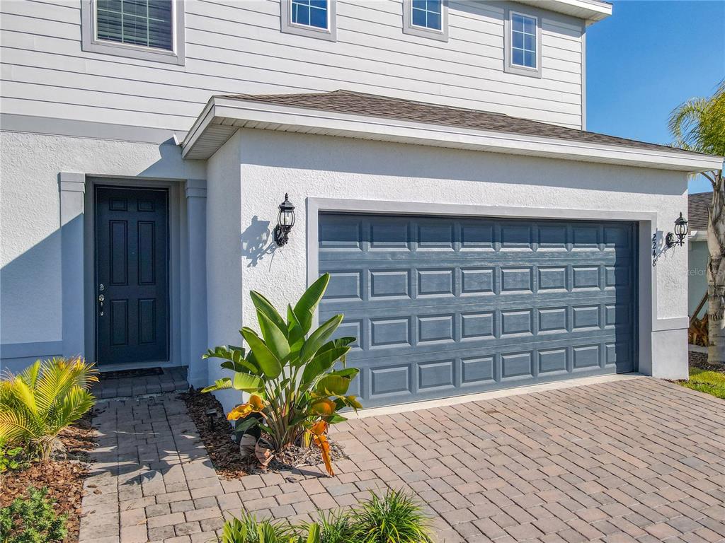 2248 Canopy Terrace Boulevard DeLand, FL 32724 - Photo 2 of 49 a front view of a house with a yard