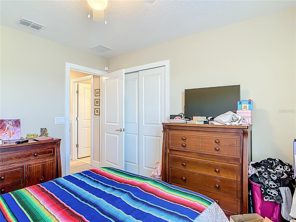 2248 Canopy Terrace Boulevard DeLand, FL 32724 - Photo 22 of 49 a room with a bed and flat screen tv