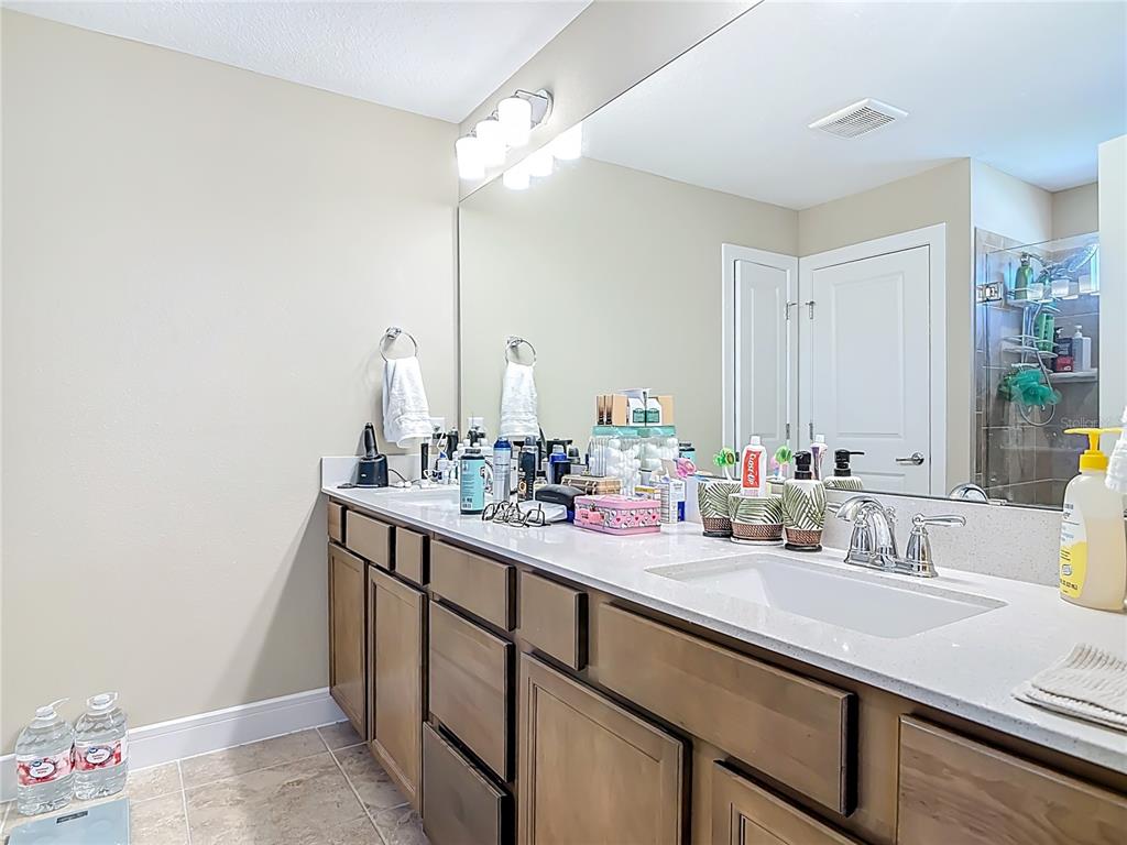 2248 Canopy Terrace Boulevard DeLand, FL 32724 - Photo 29 of 49 a bathroom with a sink and a mirror