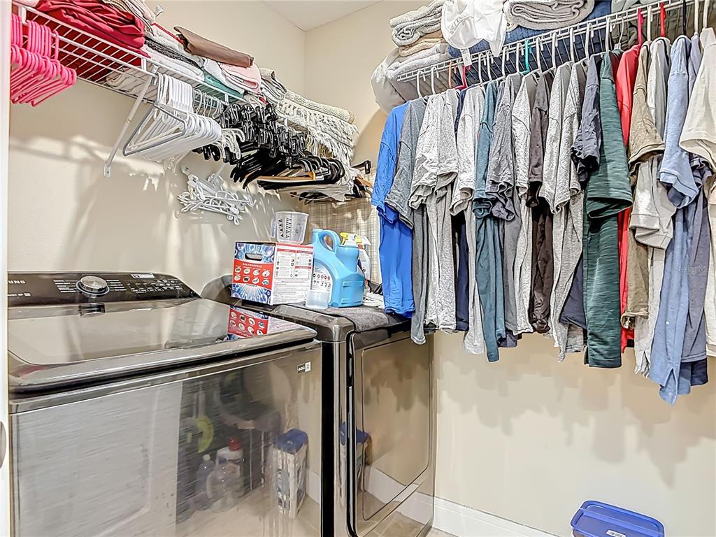 2248 Canopy Terrace Boulevard DeLand, FL 32724 - Photo 31 of 49 a view of walk in closet with clothes
