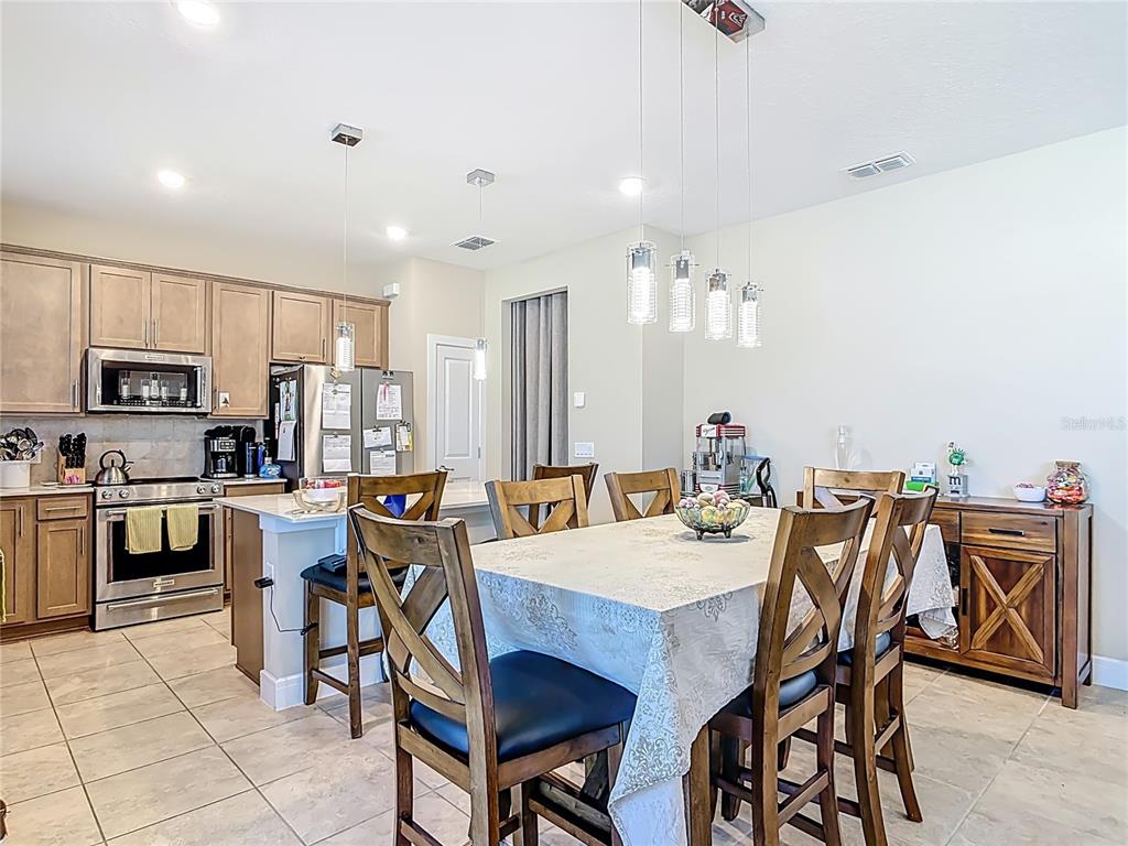 2248 Canopy Terrace Boulevard DeLand, FL 32724 - Photo 4 of 49 a view of a dining room with furniture