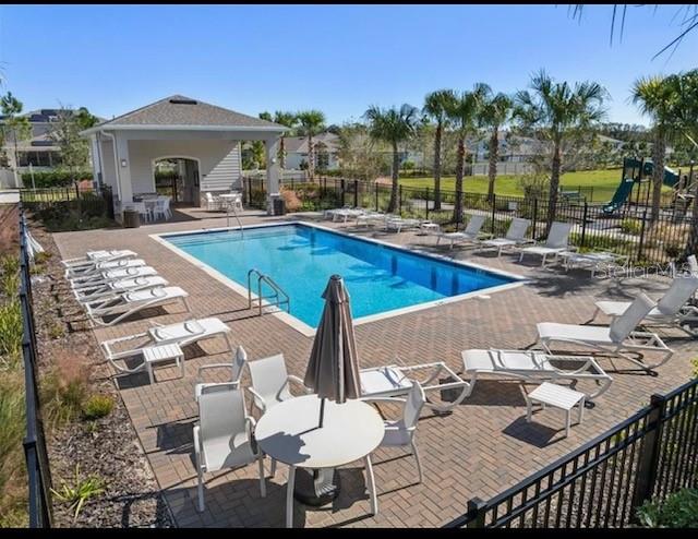 2248 Canopy Terrace Boulevard DeLand, FL 32724 - Photo 48 of 49 a view of a roof deck with furniture and a patio