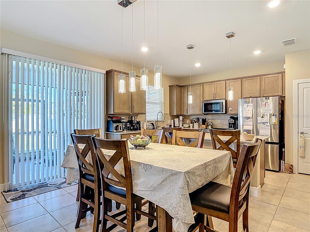 2248 Canopy Terrace Boulevard DeLand, FL 32724 - Photo 5 of 49 a view of a dining area with furniture
