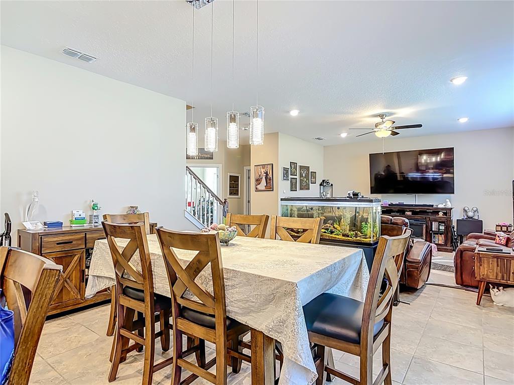 2248 Canopy Terrace Boulevard DeLand, FL 32724 - Photo 6 of 49 a view of a dining room with furniture