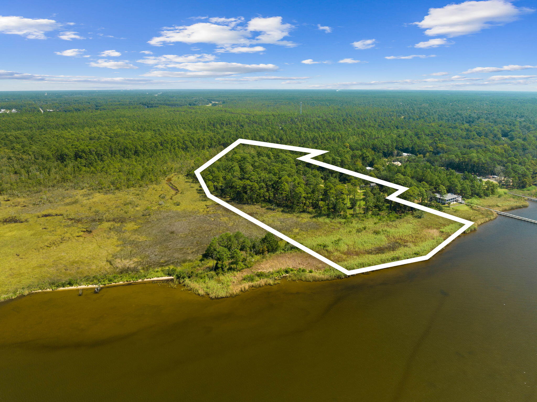 Tbd Shady Lane Freeport, FL 32439 - Photo 12 of 45 a view of a swimming pool with lawn chairs and couches