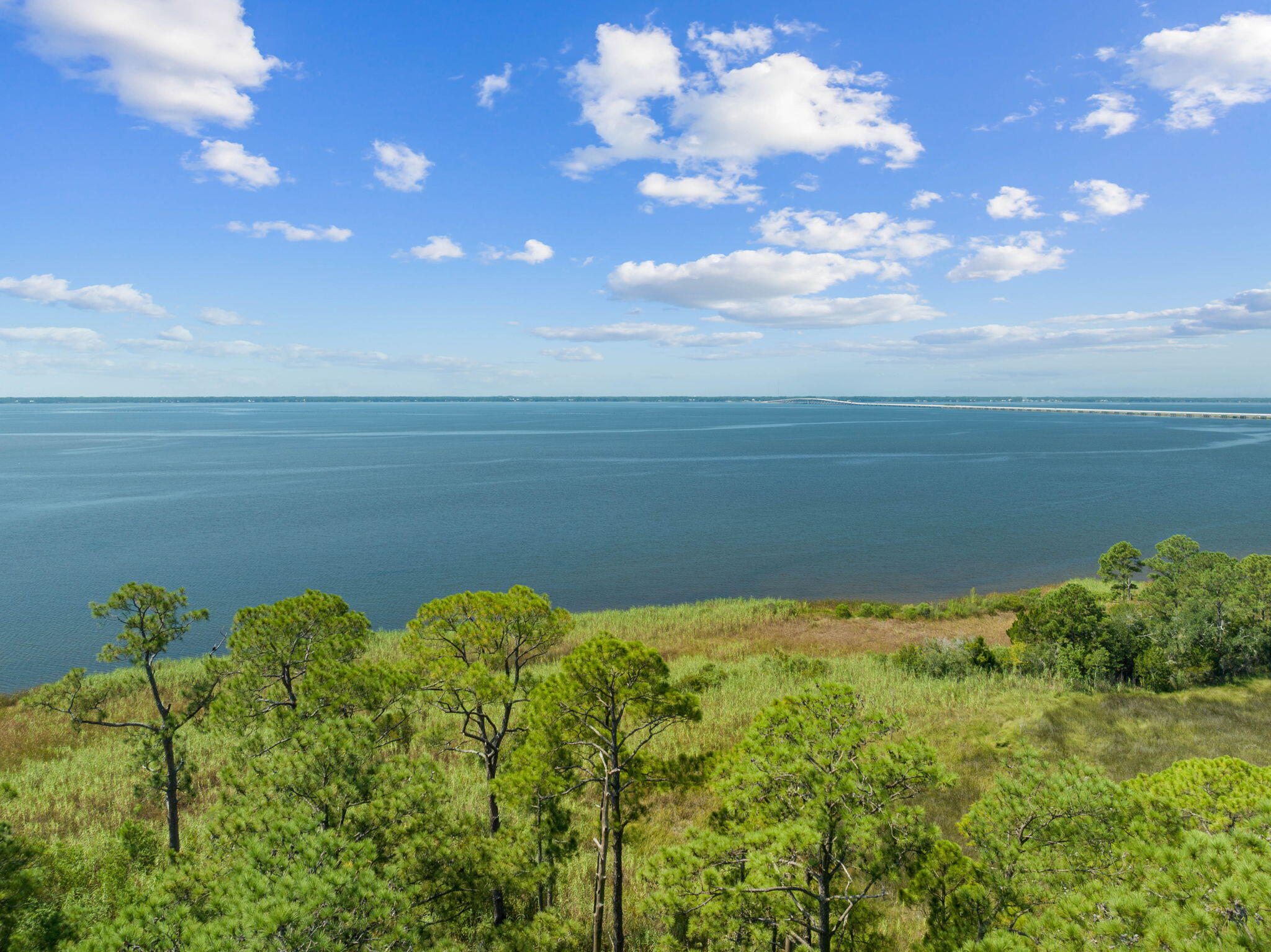 Tbd Shady Lane Freeport, FL 32439 - Photo 34 of 45 a view of a lake with a building in the background