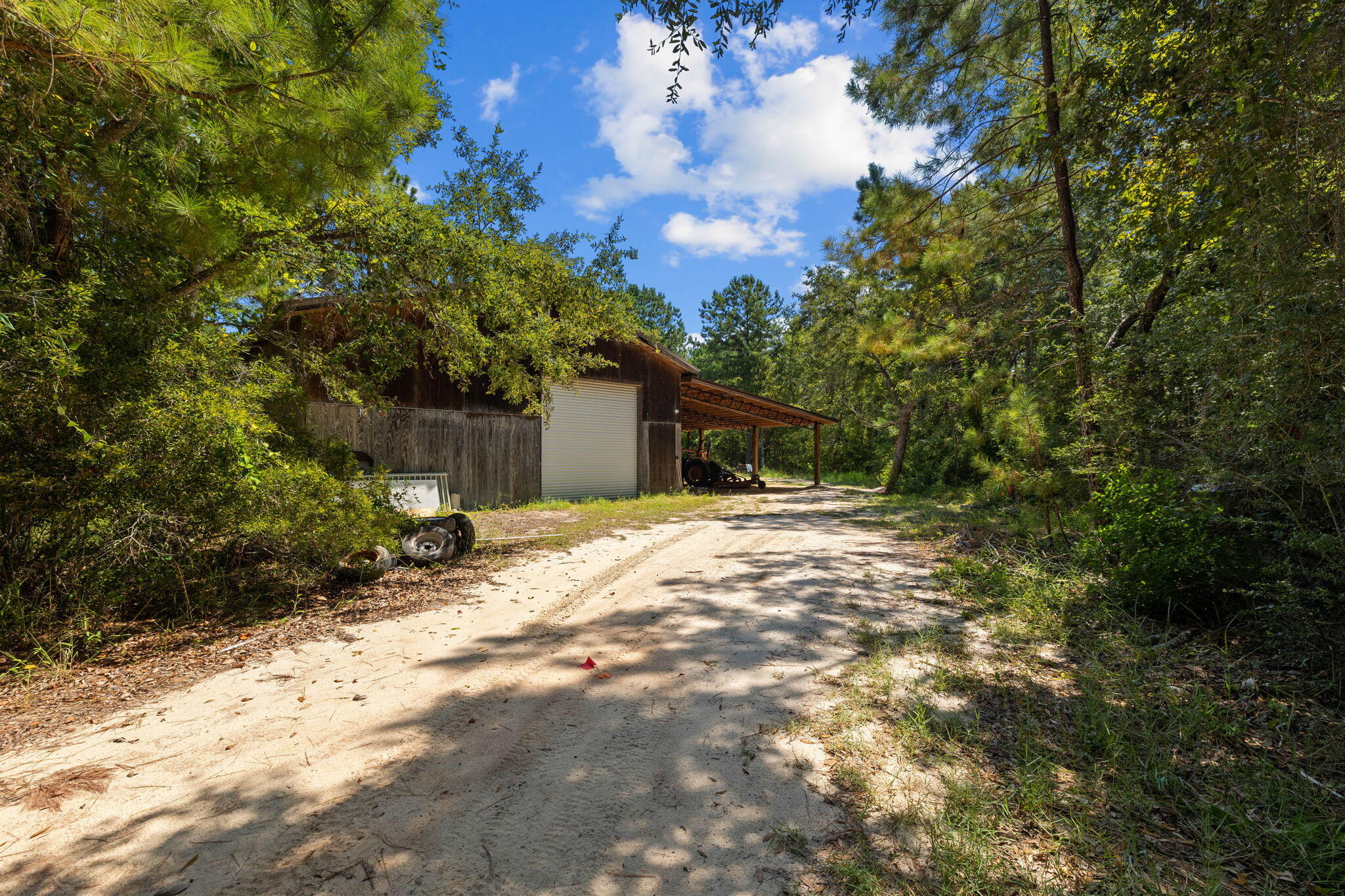 Tbd Shady Lane Freeport, FL 32439 - Photo 43 of 45 a backyard of a house with large trees