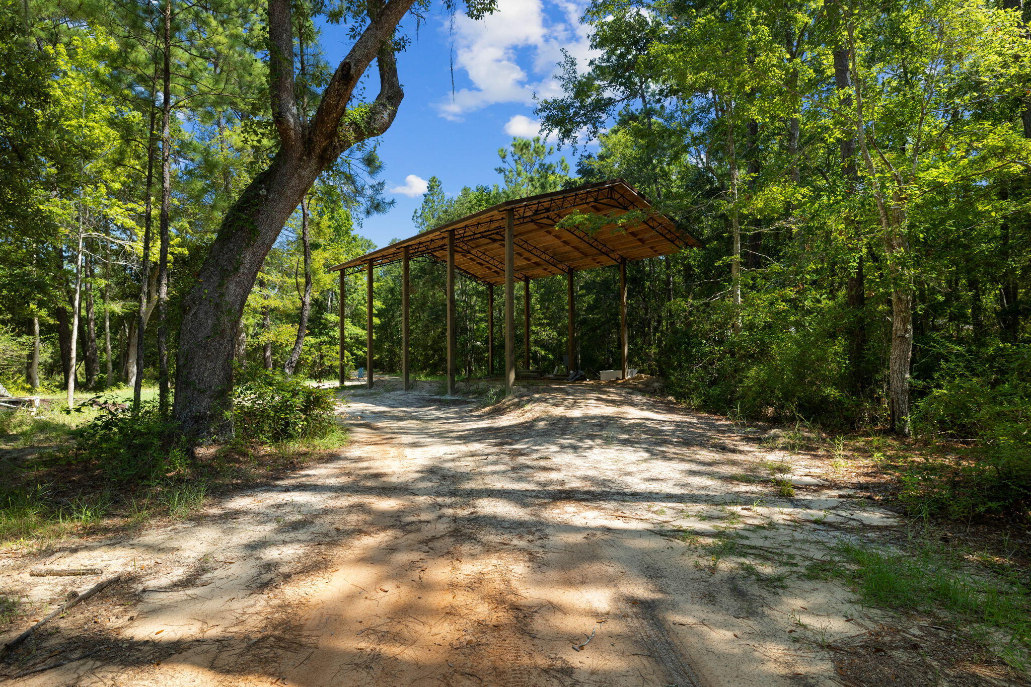 Tbd Shady Lane Freeport, FL 32439 - Photo 6 of 45 a backyard of a house with table and chairs