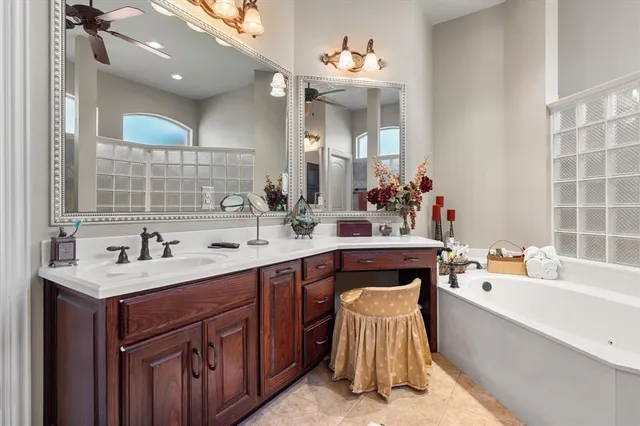 a bathroom with a double vanity sink mirror and
