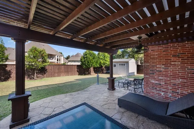 a view of a backyard with sitting area