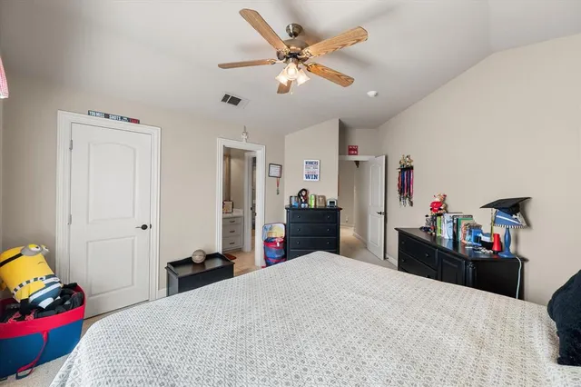 a bed room with a bed and a chandelier
