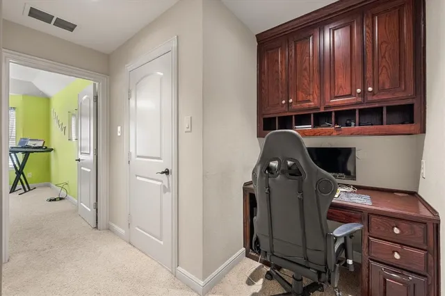 a view of a livingroom with furniture and staircase
