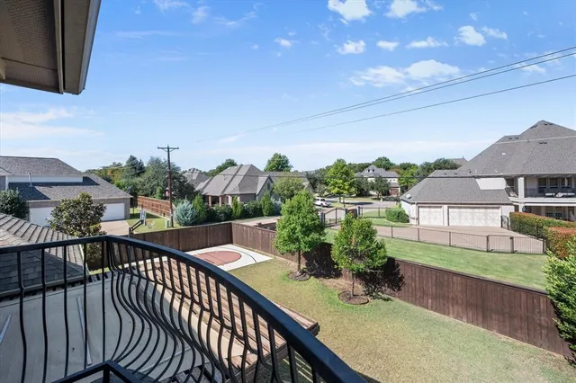 a view of a chairs and table in the balcony