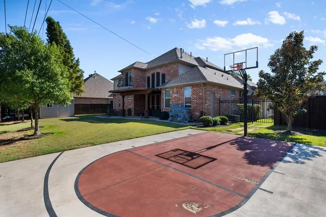 a house with swimming pool in front of it
