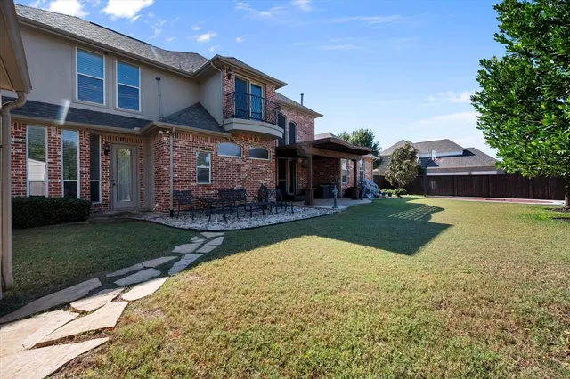 a view of a house with a yard porch and sitting area