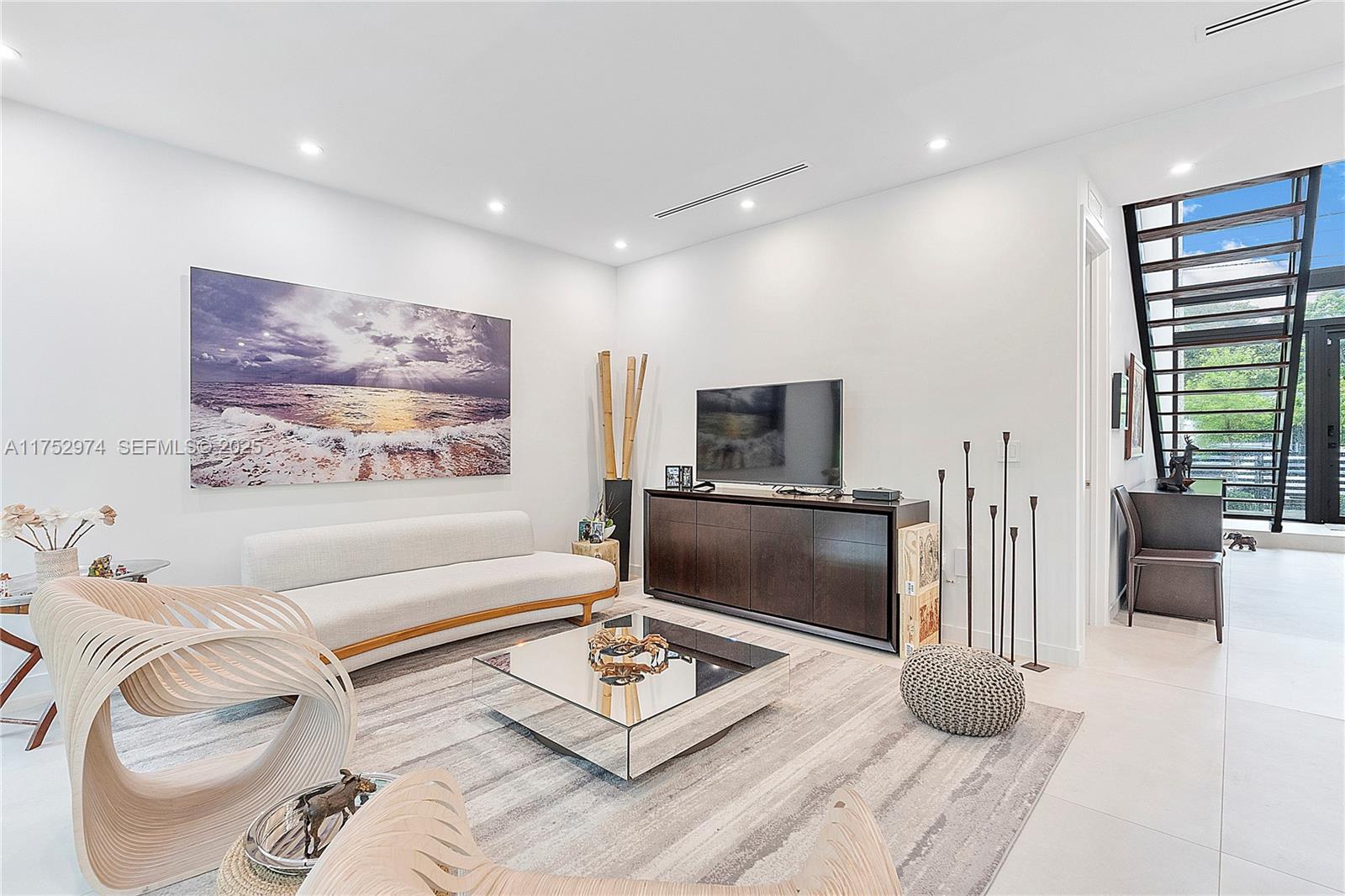 3664 Oak Avenue Miami, FL 33133 - Photo 11 of 39 a living room with furniture and a flat screen tv