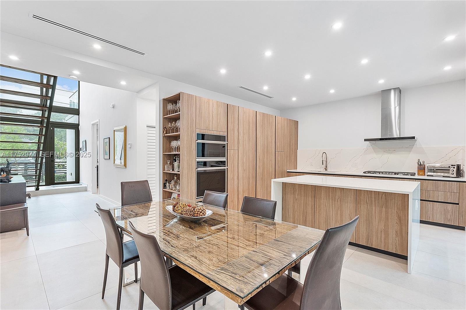 3664 Oak Avenue Miami, FL 33133 - Photo 15 of 39 a view of a dining room with furniture and window