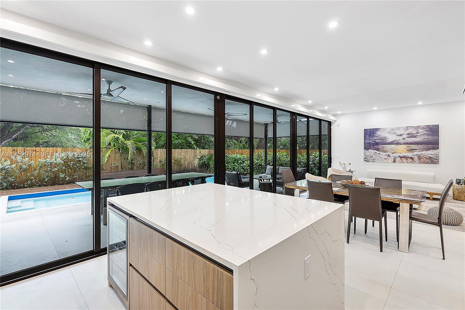 3664 Oak Avenue Miami, FL 33133 - Photo 16 of 39 a living room with large windows