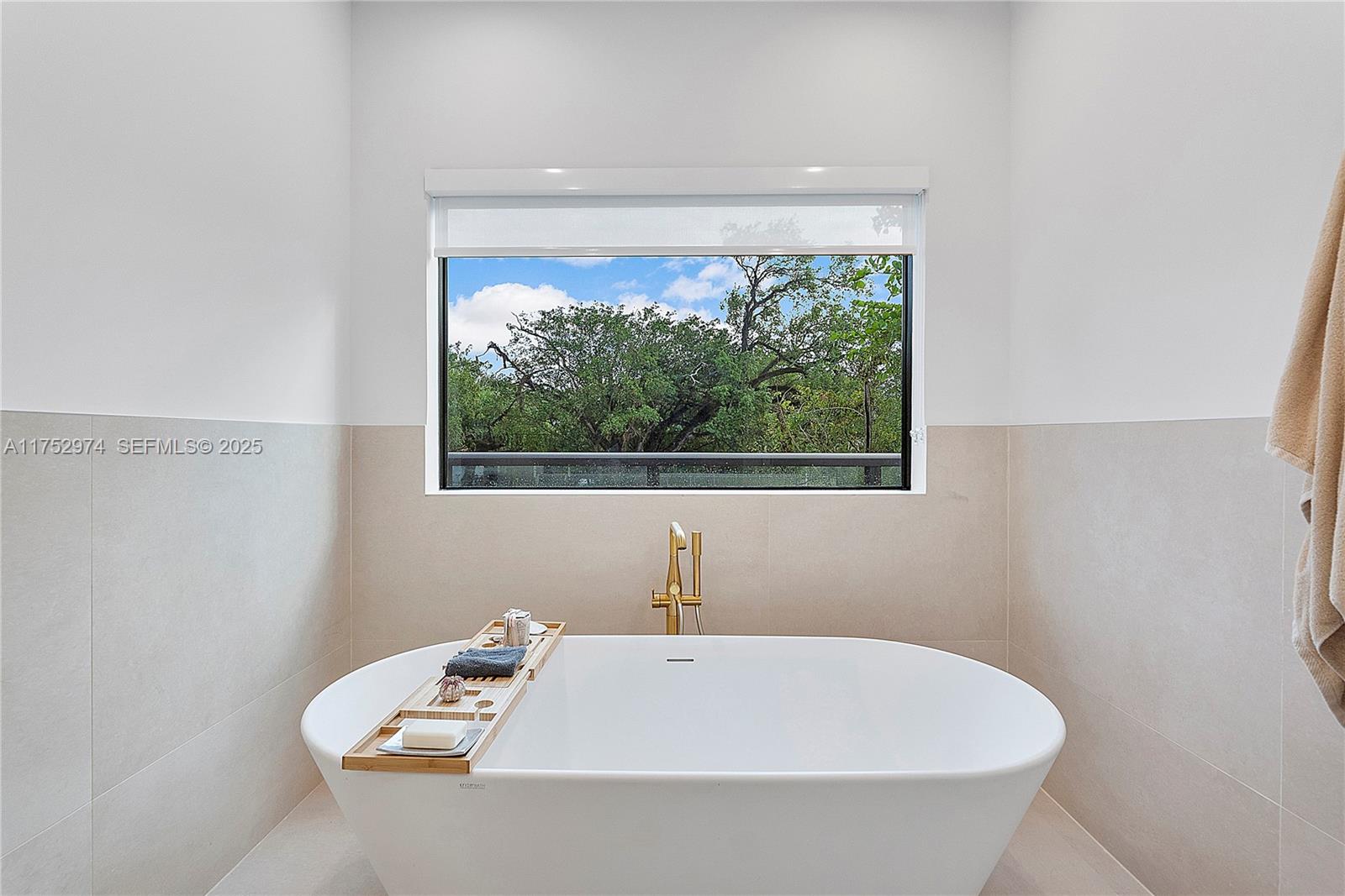 3664 Oak Avenue Miami, FL 33133 - Photo 22 of 39 a bathroom with a sink and window