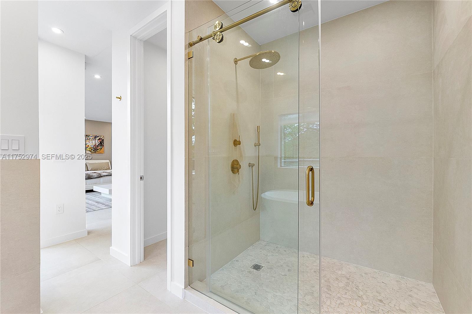 3664 Oak Avenue Miami, FL 33133 - Photo 23 of 39 a bathroom with a shower and a sink