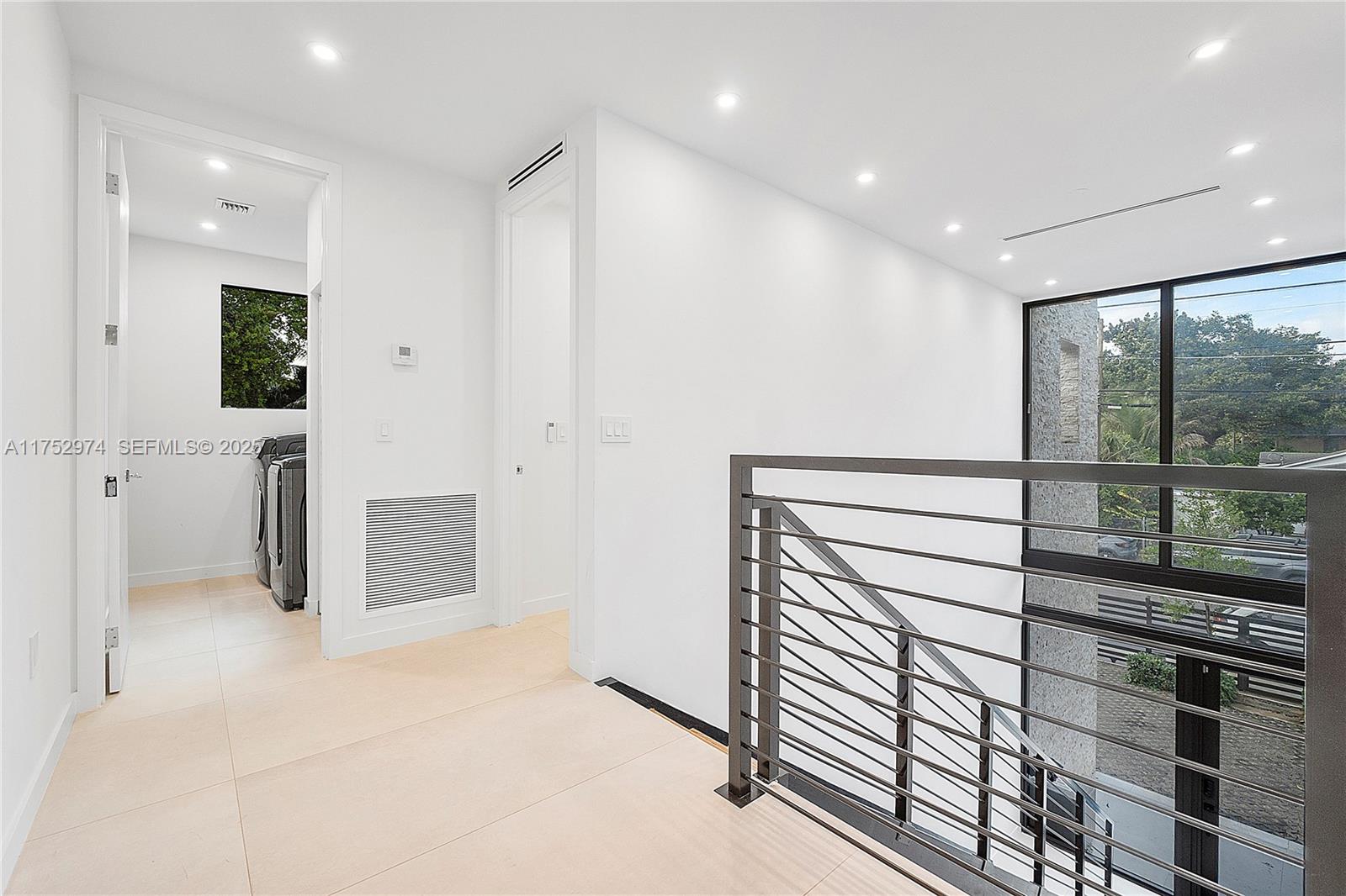 3664 Oak Avenue Miami, FL 33133 - Photo 26 of 39 a view of hallway with a large window