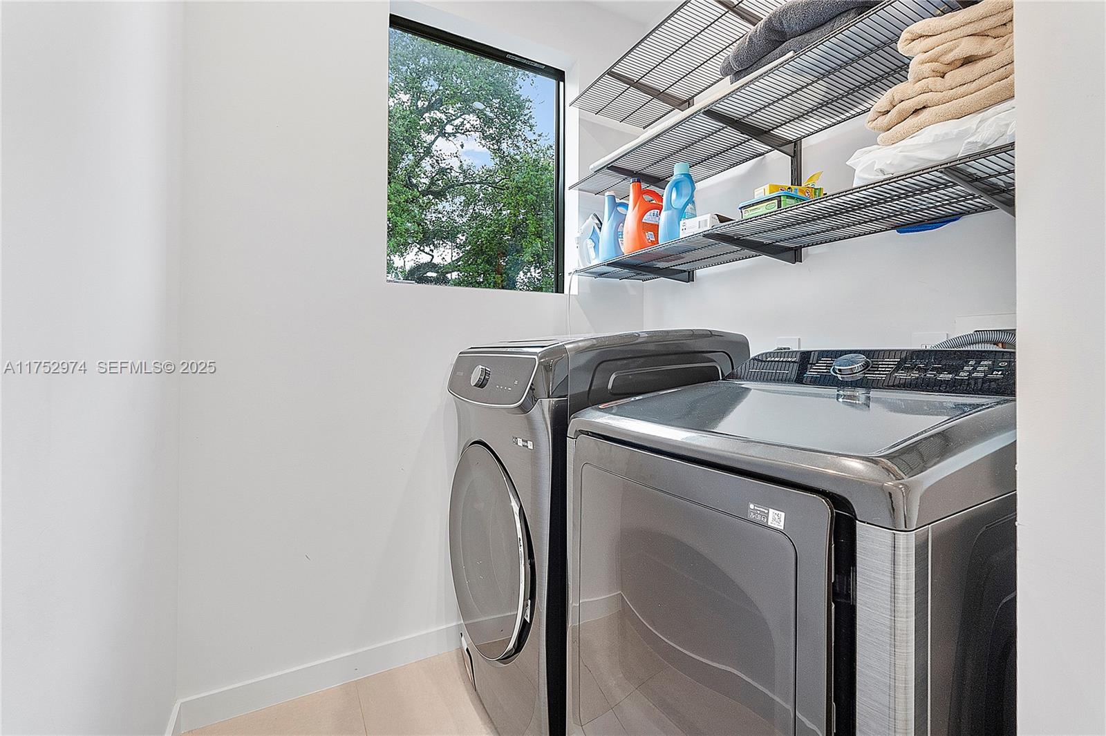3664 Oak Avenue Miami, FL 33133 - Photo 28 of 39 a utility room with dryer and washer