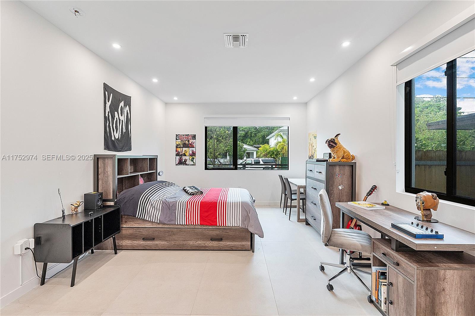 3664 Oak Avenue Miami, FL 33133 - Photo 31 of 39 a bedroom with furniture and a bed