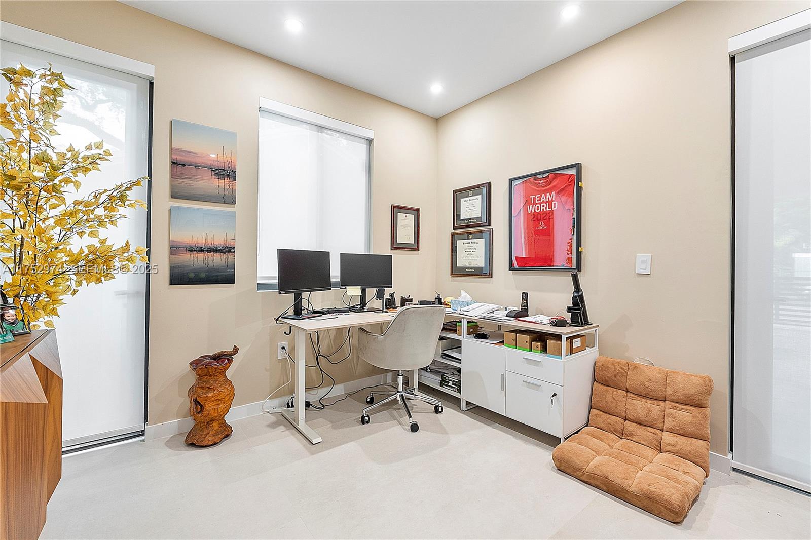 3664 Oak Avenue Miami, FL 33133 - Photo 32 of 39 a work room with furniture and a flat screen tv