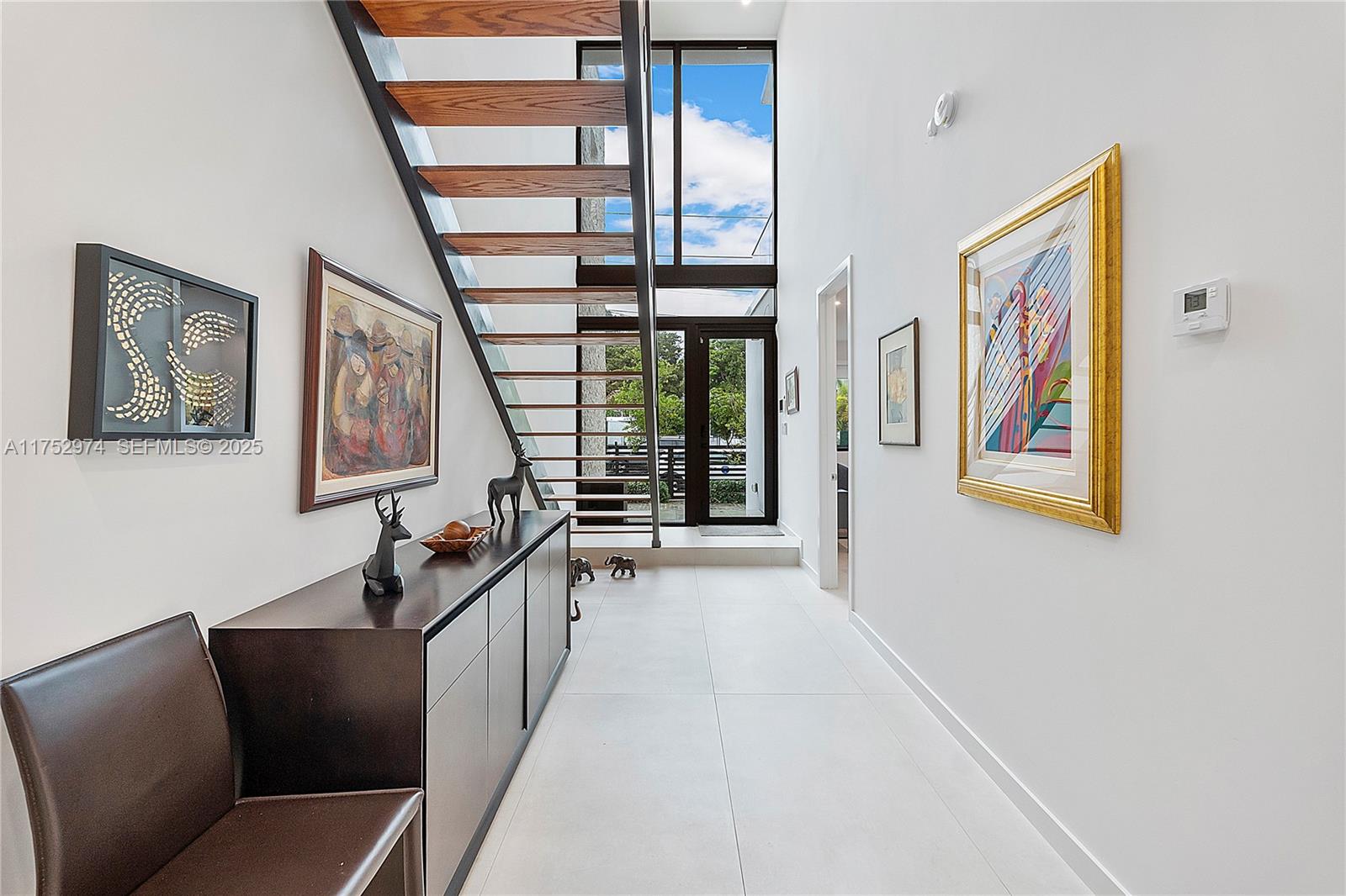 3664 Oak Avenue Miami, FL 33133 - Photo 33 of 39 a hallway with furniture and windows