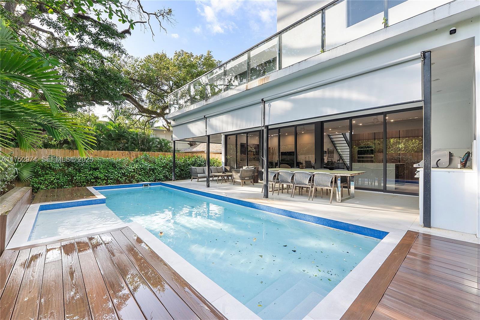3664 Oak Avenue Miami, FL 33133 - Photo 4 of 39 a view of swimming pool with chairs and yard
