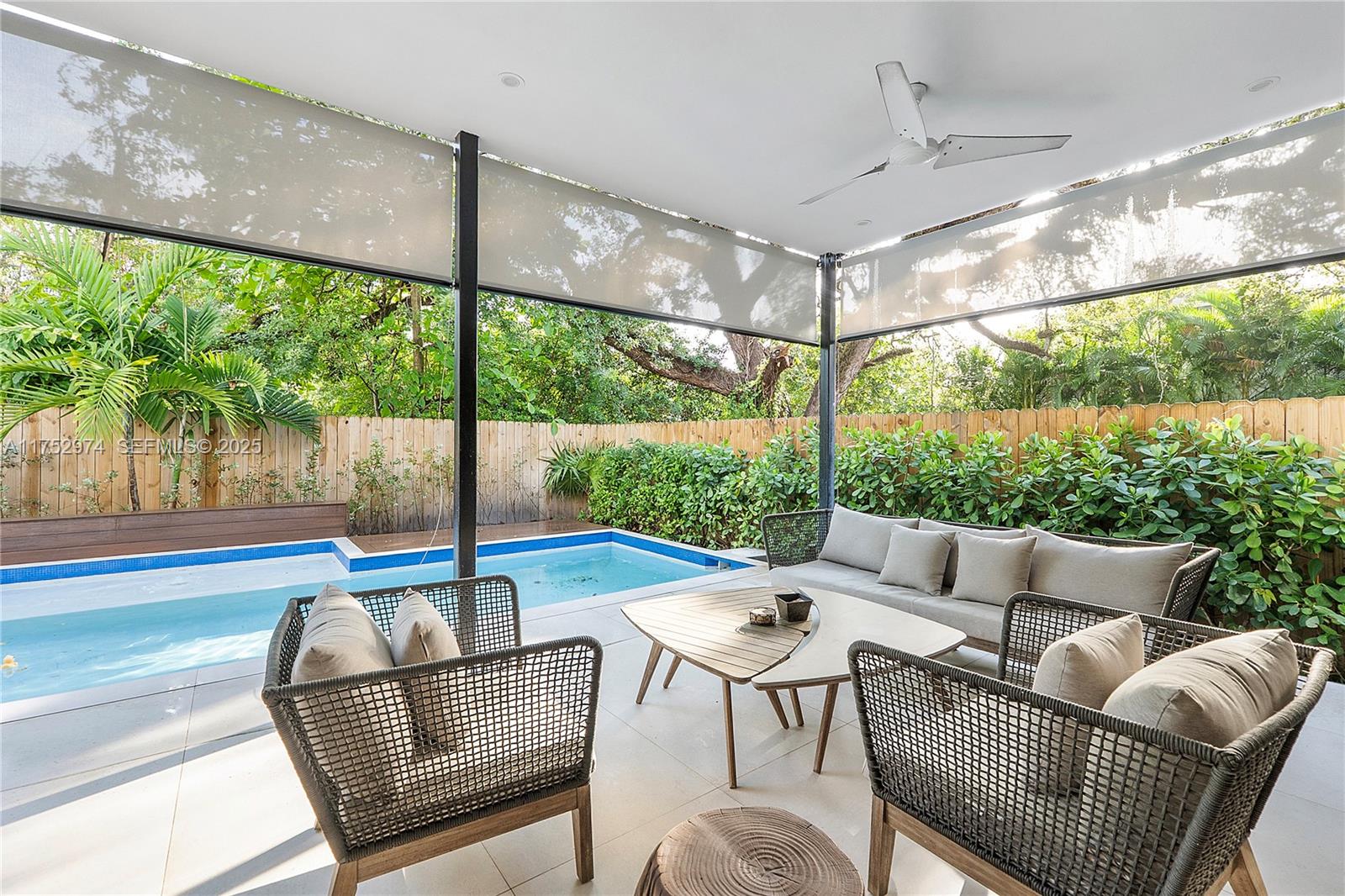 3664 Oak Avenue Miami, FL 33133 - Photo 8 of 39 a outdoor living space with furniture and garden view