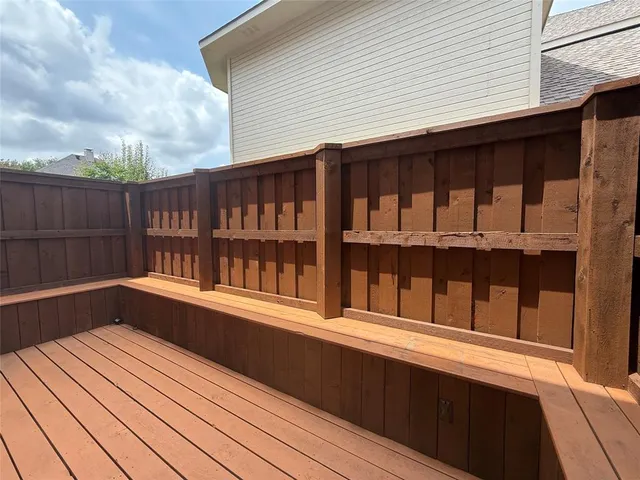 a balcony with wooden floor