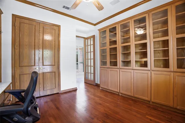 a view of a room with wooden floor and windows