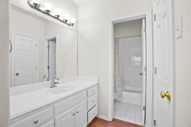 a bathroom with a sink double vanity and a mirror