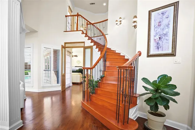 a view of entryway with wooden floor and a potted plant