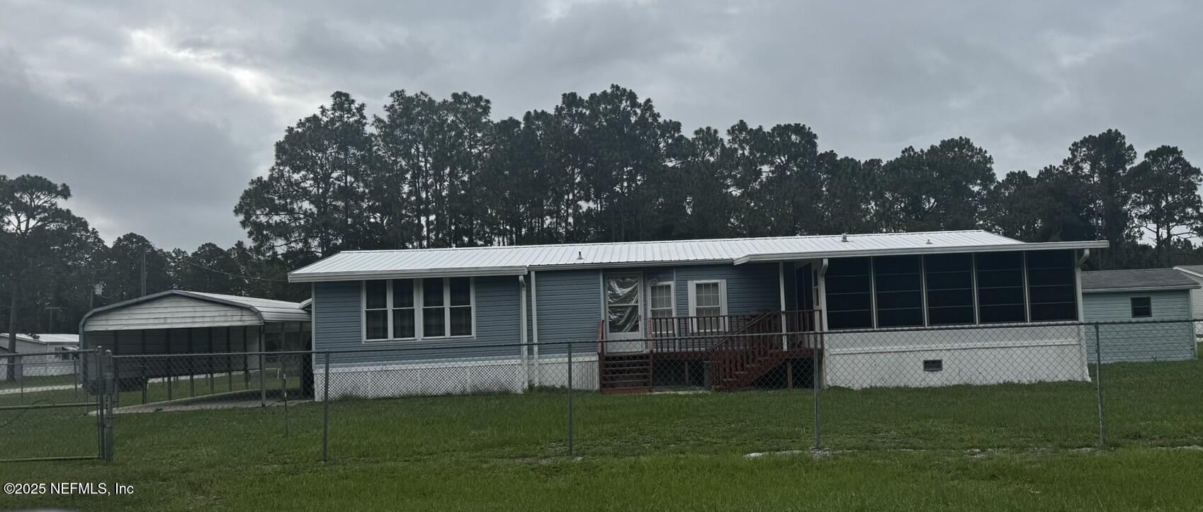 115 Edgemere Drive Georgetown, FL 32139 - Photo 1 of 24 a house view with a garden space