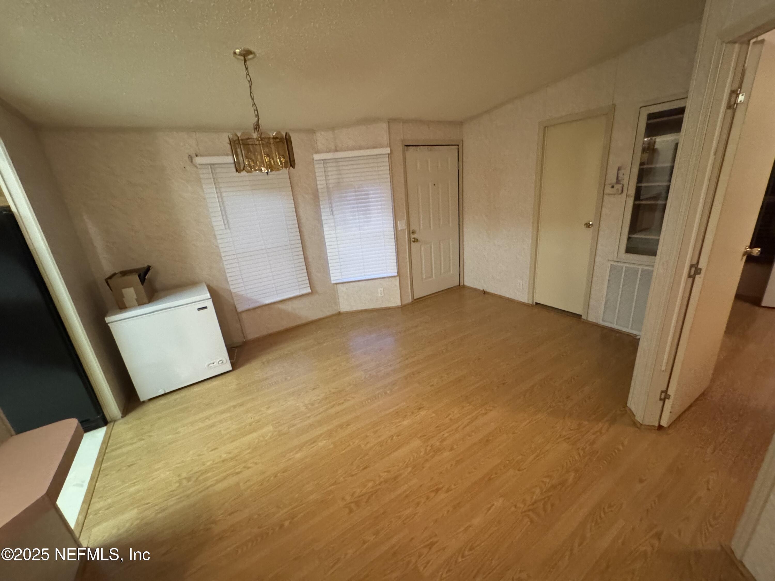 115 Edgemere Drive Georgetown, FL 32139 - Photo 11 of 24 a view of empty room with wooden floor