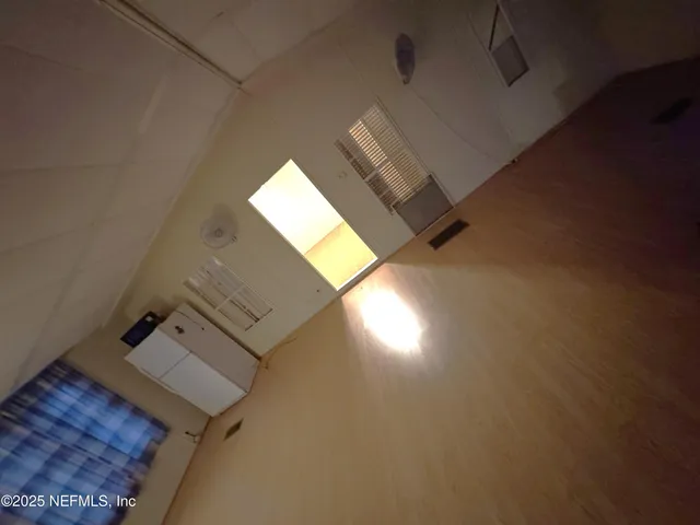 a bathroom with a sink and mirror with toilet