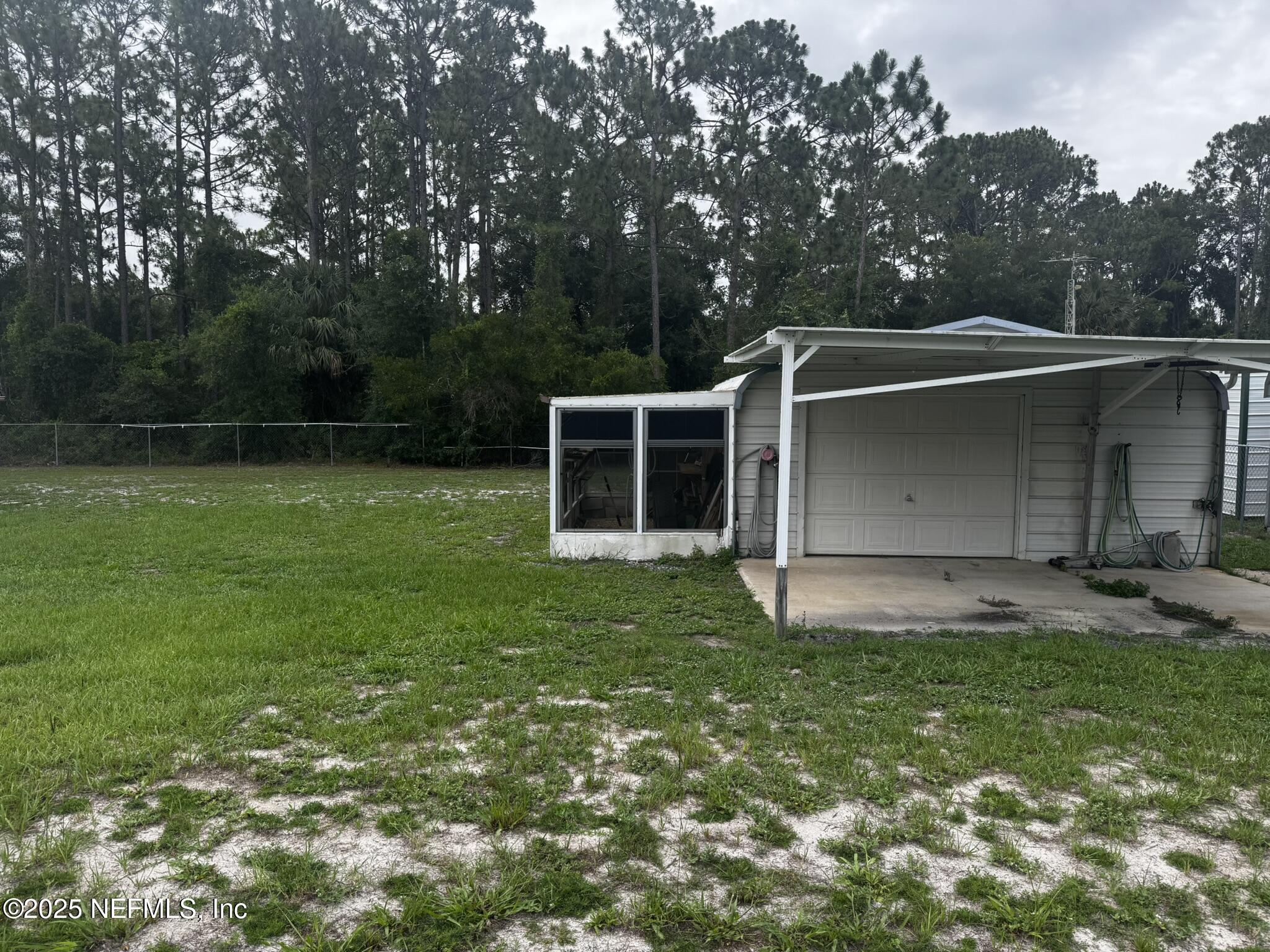 115 Edgemere Drive Georgetown, FL 32139 - Photo 9 of 24 a backyard of a house with yard and trampoline