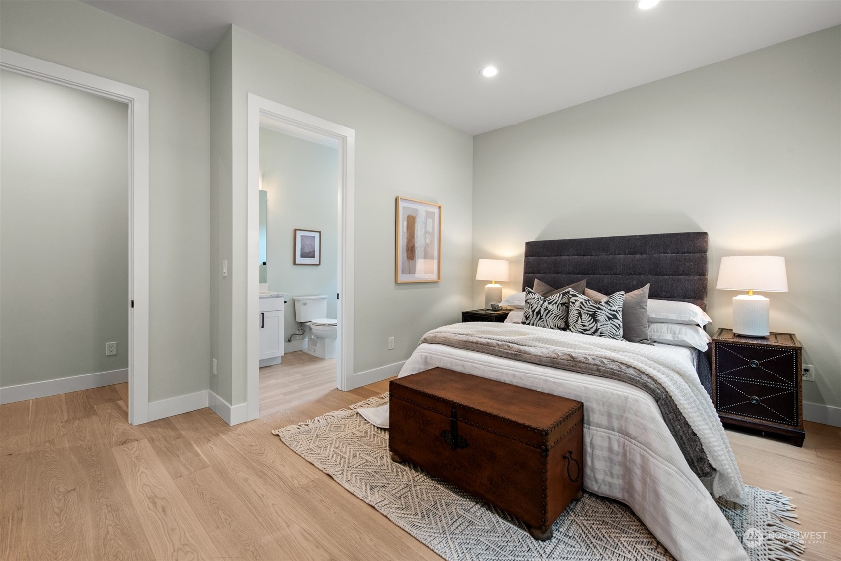 14240 Southeast Allen Rd. Bellevue, WA 98006 - Photo 11 of 32 a bedroom with a bed and a lamp