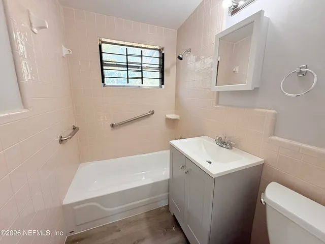 a bathroom with a sink a toilet and bathtub