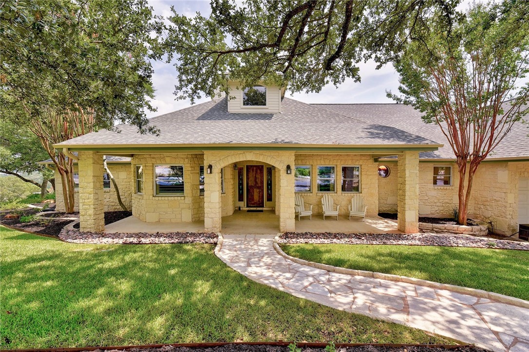 9311 Simmons Road Austin, TX 78759 - Photo 1 of 1 front view of a house with a yard