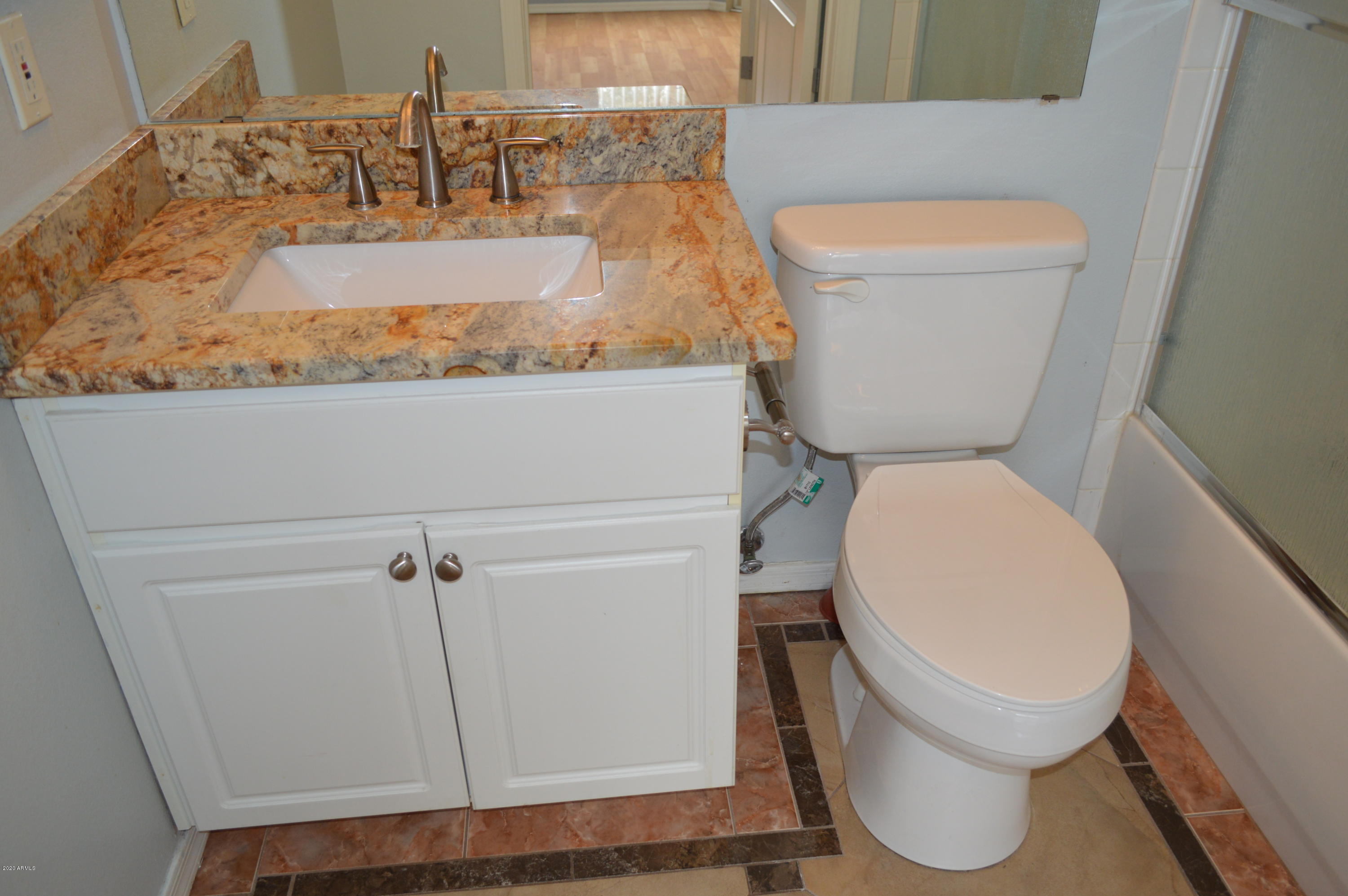 1701 East Colter Street, Unit 308 Phoenix, AZ 85016 - Photo 14 of 50 a bathroom with a toilet and a sink