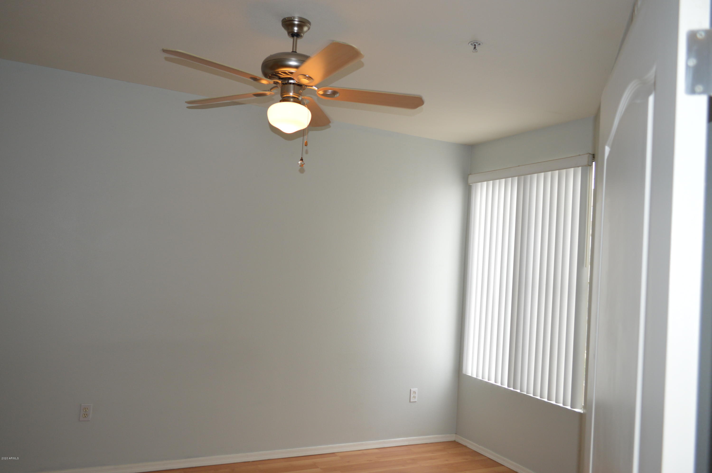 1701 East Colter Street, Unit 308 Phoenix, AZ 85016 - Photo 17 of 50 a view of a room with a window and a fan