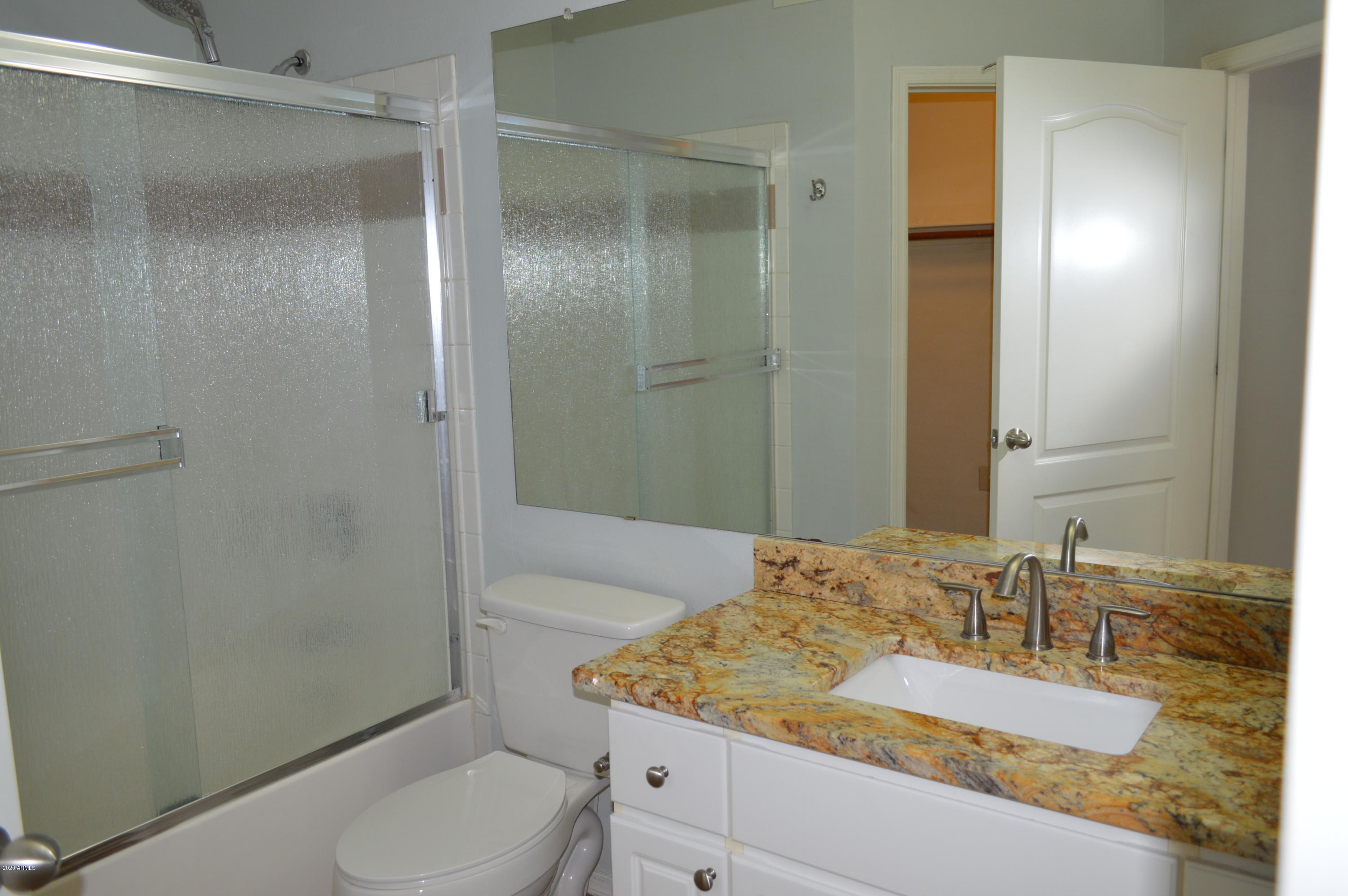1701 East Colter Street, Unit 308 Phoenix, AZ 85016 - Photo 20 of 50 a bathroom with a granite countertop sink toilet and shower