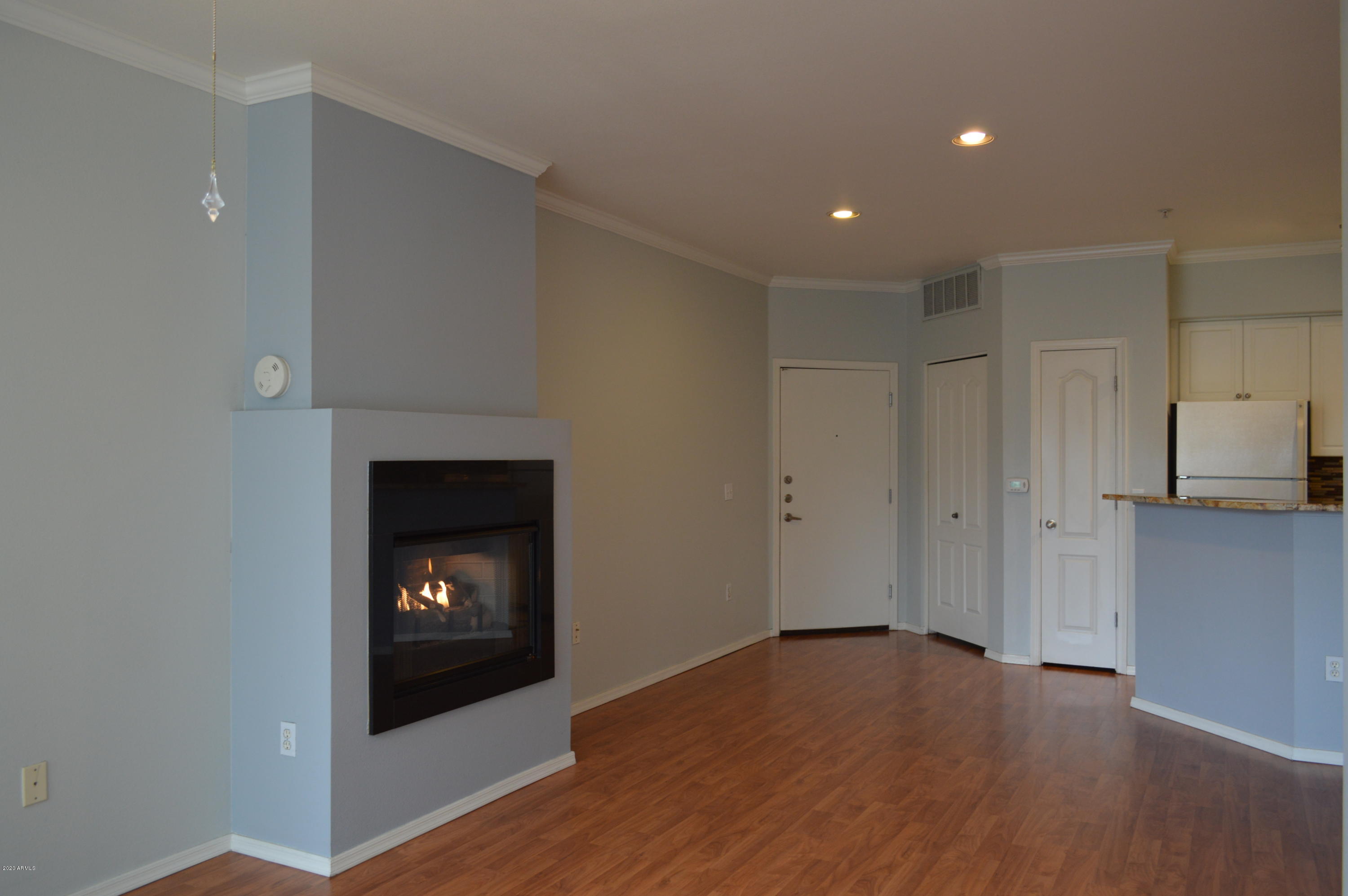 1701 East Colter Street, Unit 308 Phoenix, AZ 85016 - Photo 2 of 50 a view of an empty room and a fireplace