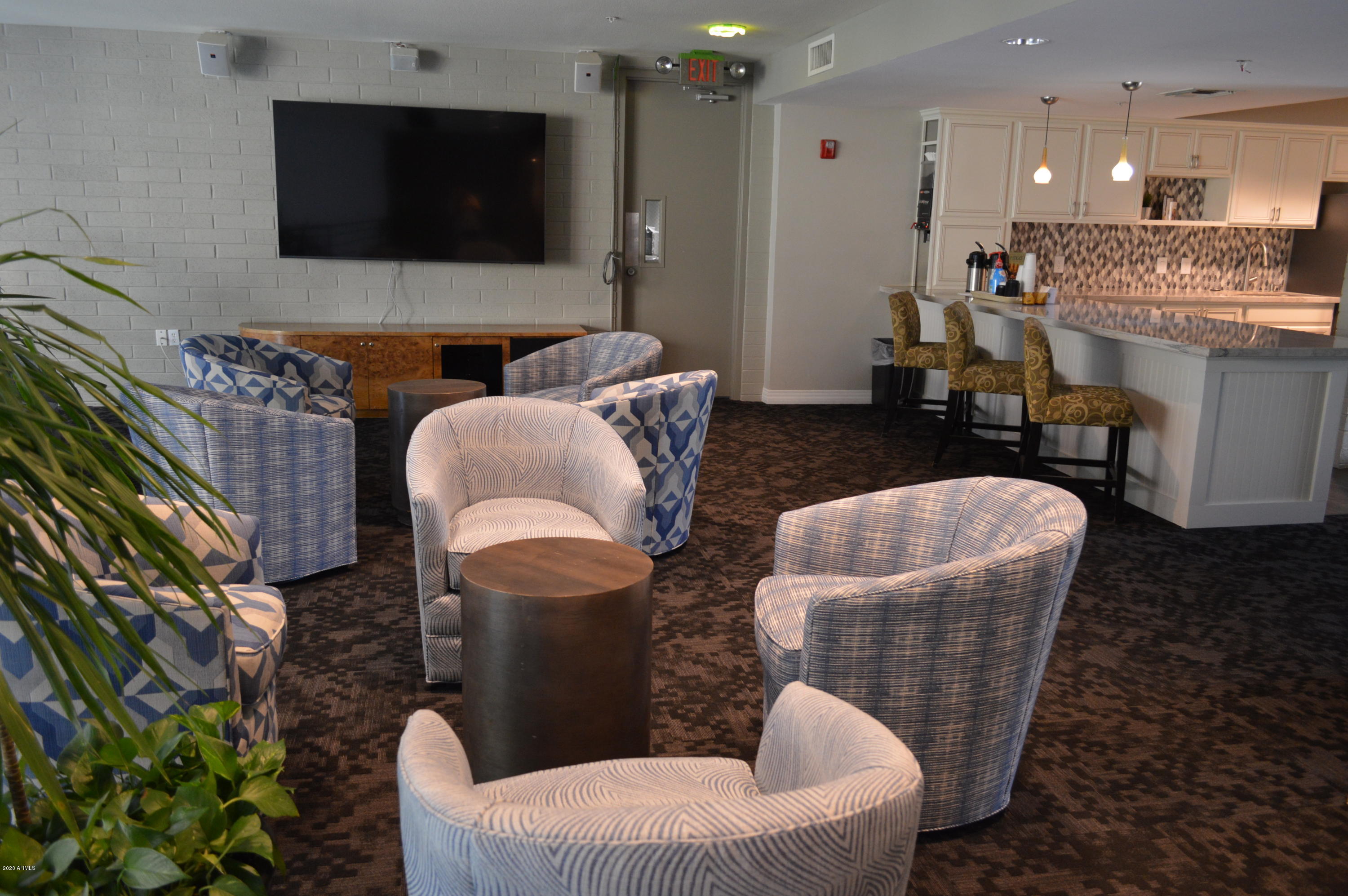 1701 East Colter Street, Unit 308 Phoenix, AZ 85016 - Photo 37 of 50 a living room with furniture and a flat screen tv