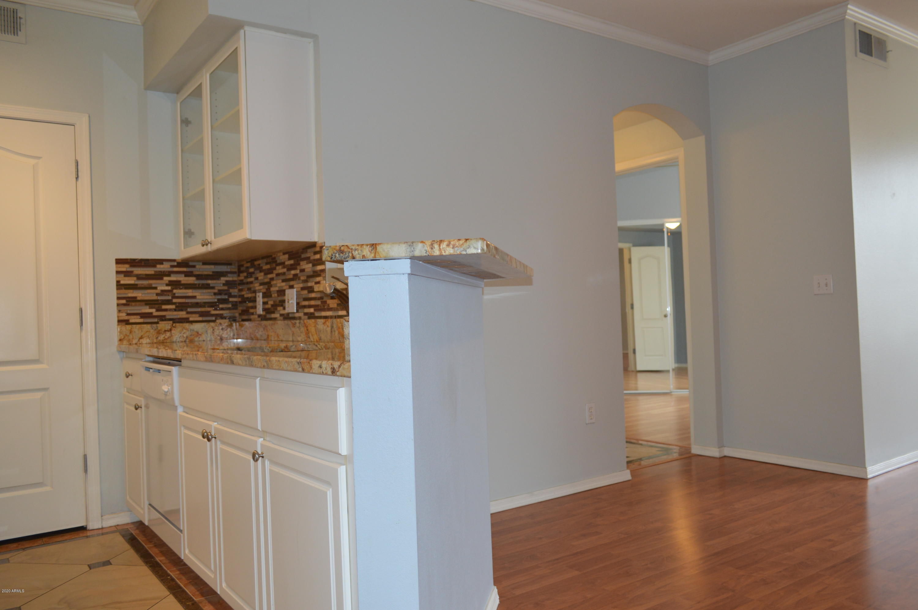 1701 East Colter Street, Unit 308 Phoenix, AZ 85016 - Photo 5 of 50 wooden floor with cabinet in front of door