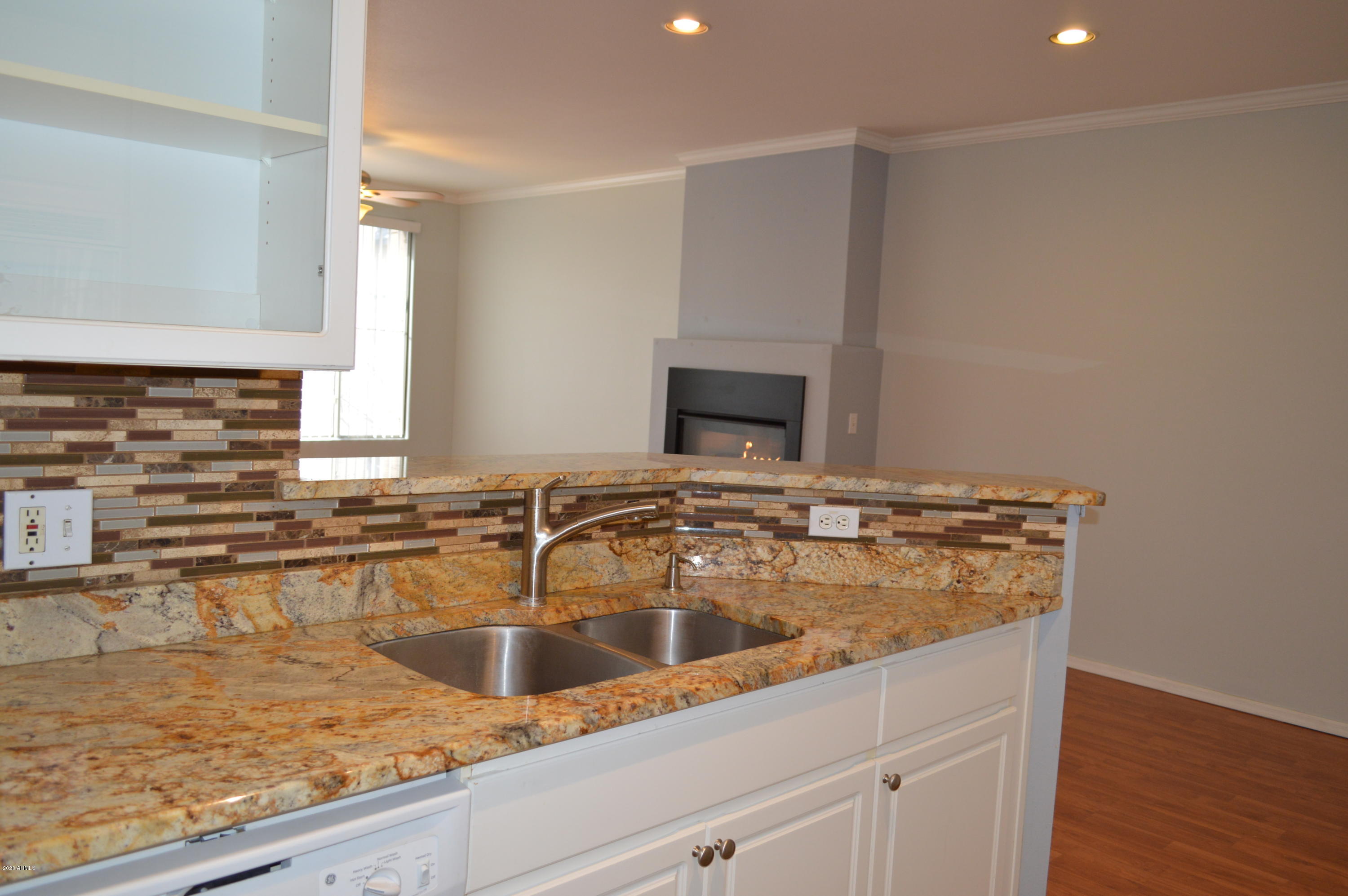 1701 East Colter Street, Unit 308 Phoenix, AZ 85016 - Photo 6 of 50 a kitchen with a sink and a stove top oven