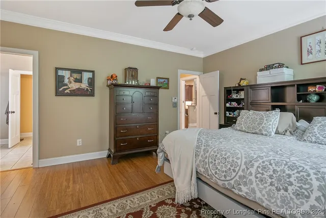 a bedroom with a bed and dresser